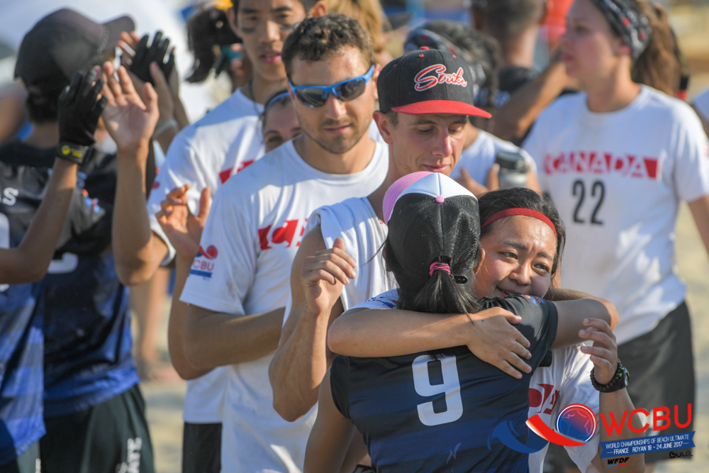 Filipino and Canadian players greet each other at the end of a tough game. Photo by Deepthi Indukuri.